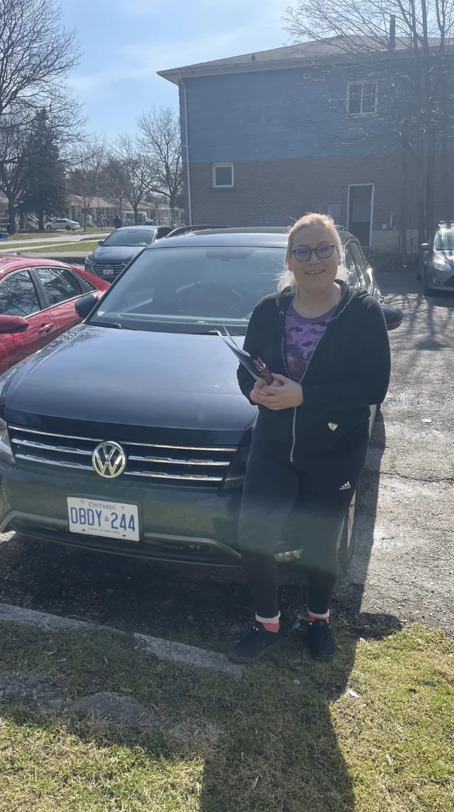 Happy customer with new vehicle